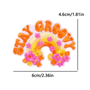 Detailed view of Stay Groovy rainbow floral embroidery patch with 6cm x 4.6cm dimensions