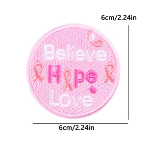Detailed 6cm round embroidered patch with 'Believe Hope Love' and pink ribbon patterns
