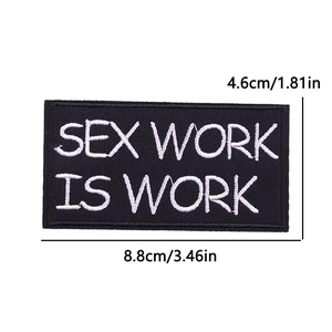 Macro shot of rectangular embroidered patch with white text and precise size measurements