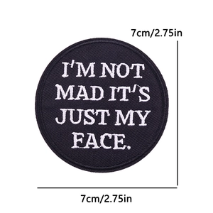 Detailed view of round 2.75 inch black patch with white embroidered sarcastic quote
