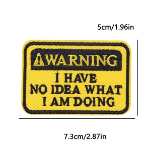 Detail showing embroidered Warning patch with dimensions 7.3cm by 5cm for DIY clothing