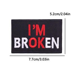 Close-up of I'M BROKEN embroidered patch with red OK detail measuring 7.7x5.2cm