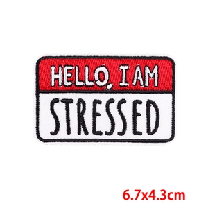 Detail of HELLO I AM STRESSED cartoon embroidery patch measuring 6.7x4.3cm for DIY clothing