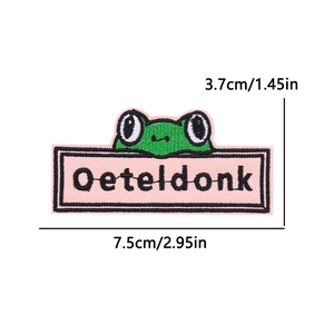 Detailed pink Oeteldonk embroidery patch with green frog motif, size 7.5cm by 3.7cm