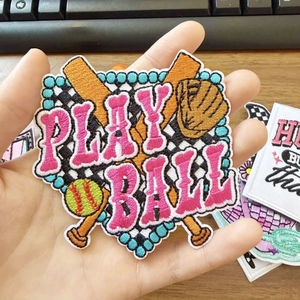 Detailed close-up of a baseball-themed embroidery patch with Play Ball text and fine stitching