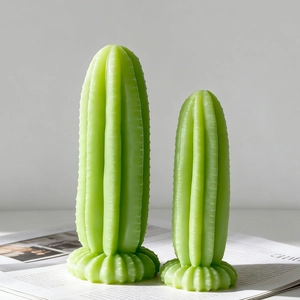 Green cactus shaped aroma candle mold in two sizes on minimalist magazine background