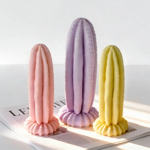 Detailed texture of textured cactus-shaped candle ornaments in pastel pink, yellow and purple