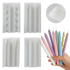 Macro detail of striped and spiral silicone candle molds with colorful candle samples