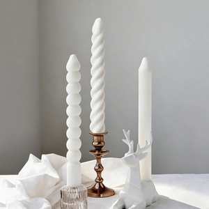 Striped pillar and spiral silicone candle molds with elegant candle holders set