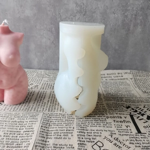 Detail of female torso silicone mold for candles showing textured split line and texture
