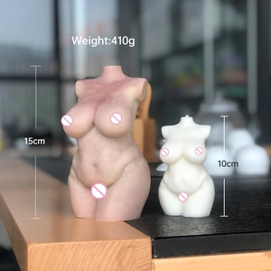 Detail showing two female torso candles in 15cm and 10cm sizes on a wooden surface