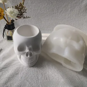 Detail view of translucent skull silicone mold and a white resin skull flower pot container