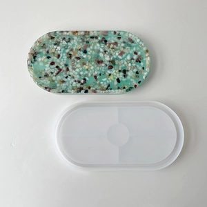 Oval silicone mold for DIY resin trays with finished terrazzo style decorative coaster