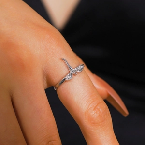 Elegant silver gothic dragon ring with sparkling crystal wings worn on a finger