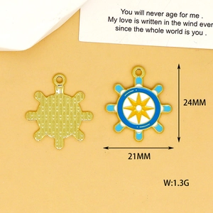 Detailed view showing front and back of blue enamel ship wheel charm with dimensions
