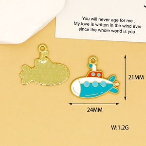 Close-up of submarine enamel charms showing 21mm by 24mm size and 1.2g weight