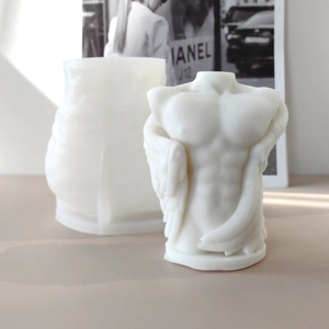Macro view of translucent silicone mold and white angel wing male torso candle statue