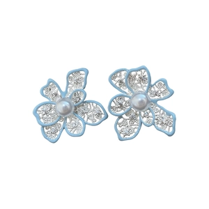 Elegant light blue enamel hollow flower stud earrings with pearl center and silver finish