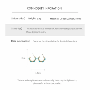 Detail view showing dimensions of vintage gold-plated C-shaped earrings with zircons