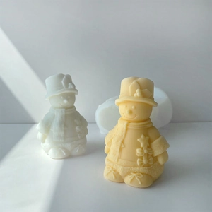 Detailed silicone mold and finished cute snowman candles with scarf and hat accents