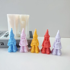 Detail showing silicone gnome molds and colorful DIY resin gnome figurines for candles