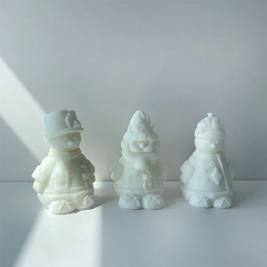 Detailed view of white matte Christmas snowman and Santa Claus wax candle molds