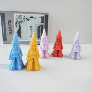 Five colorful gnome scented candles showing detailed textures of hats and scarves