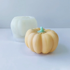 Macro view of pumpkin silicone mold and finished handmade candle with detailed textures