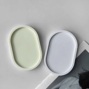Detail view of oval tray molds in cream and white for DIY resin or gypsum storage