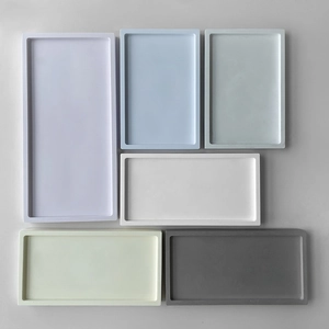 Minimalist rectangular storage trays in various sizes and matte pastel colors