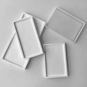 Detail view of four rectangular silicone molds in white for DIY resin storage trays