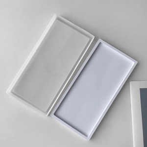 Macro view of rectangular silicone tray molds in frosted and white matte finish