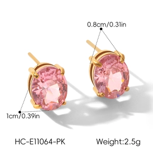 Detail view of 18k gold plated stainless steel stud earrings with pink oval crystals.