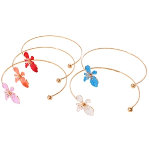 Detailed close-up view of five colorful oil-dripped flower petal chokers in retro gold finish