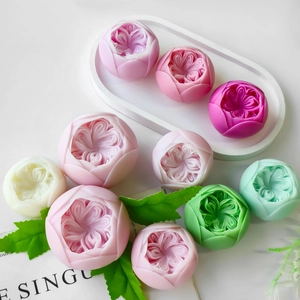 Detailed view of assorted Austin rose scented candles made from silicone flower molds