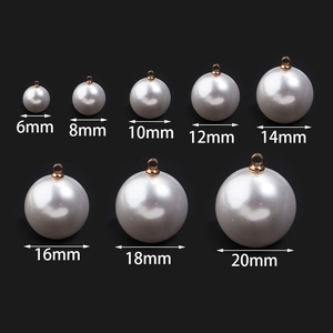 Glossy white pearl buttons with gold metal bases in 8 sizes ranging from 6mm to 20mm