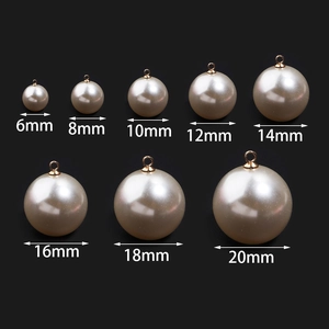 Size chart showing 6mm to 20mm pearl ball pendants with golden metal loops on black background