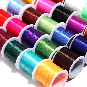 Macro shot of colorful flat elastic crystal string rolls for DIY jewelry making
