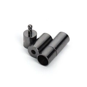 Detailed macro of gunmetal cylindrical copper clasps for leather necklaces and bracelets
