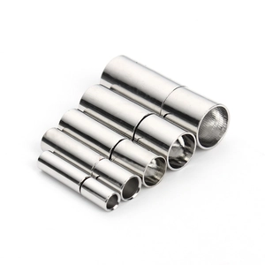 Close-up of five silver magnetic clasps for necklaces and bracelets in various sizes