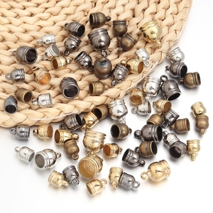 Mix of bell-shaped tassel caps in gold, silver, and bronze for DIY jewelry crafting