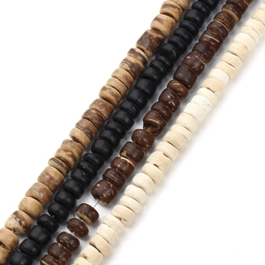 Detailed macro view of flat disc wooden beads in four natural colors for DIY jewelry