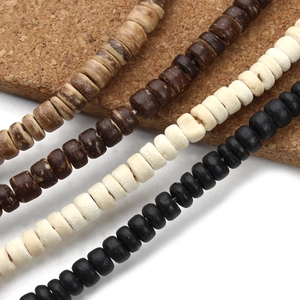 Close-up of assorted natural wooden rondelle spacer beads in four earthy tones for DIY jewelry