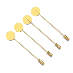 Detailed view of four polished gold-plated copper stick pins for DIY jewelry making