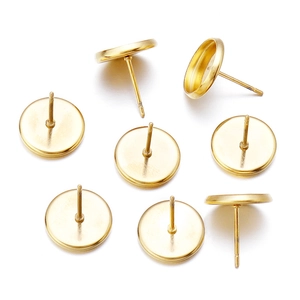 Macro detail of gold round flat base earring studs for DIY jewelry making findings