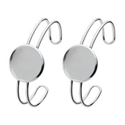 Macro view of silver DIY bangle bases with round tray settings for cabochon jewelry making