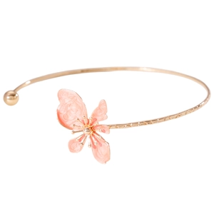 Detailed close-up of a vintage gold choker featuring a pink enamel flower pendant