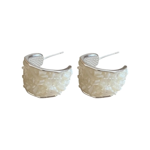 Elegant silver C-shaped stud earrings with textured mother-of-pearl shell finish on white background