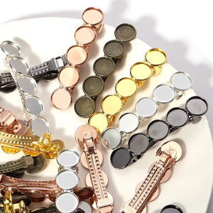 Macro shot of 5-disc metal hair clip bases in gold and silver for DIY jewelry making