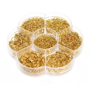 Golden open jump rings set for DIY jewelry making in a 7-compartment petal storage box